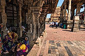 The great Chola temples of Tamil Nadu - The Brihadishwara Temple of Thanjavur. Brihadnayaki Temple (Amman temple) pilgrims resting in the shade of the mandapa. 